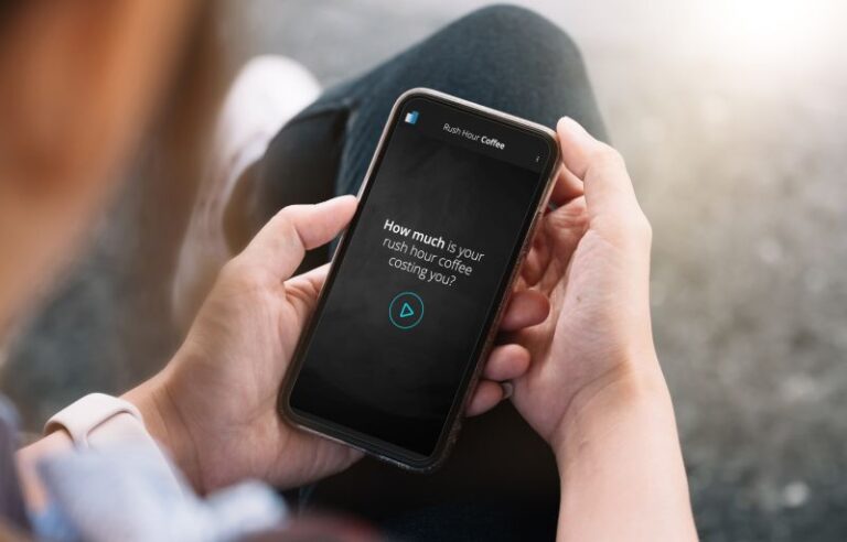 Man holding a phone with the coffee app